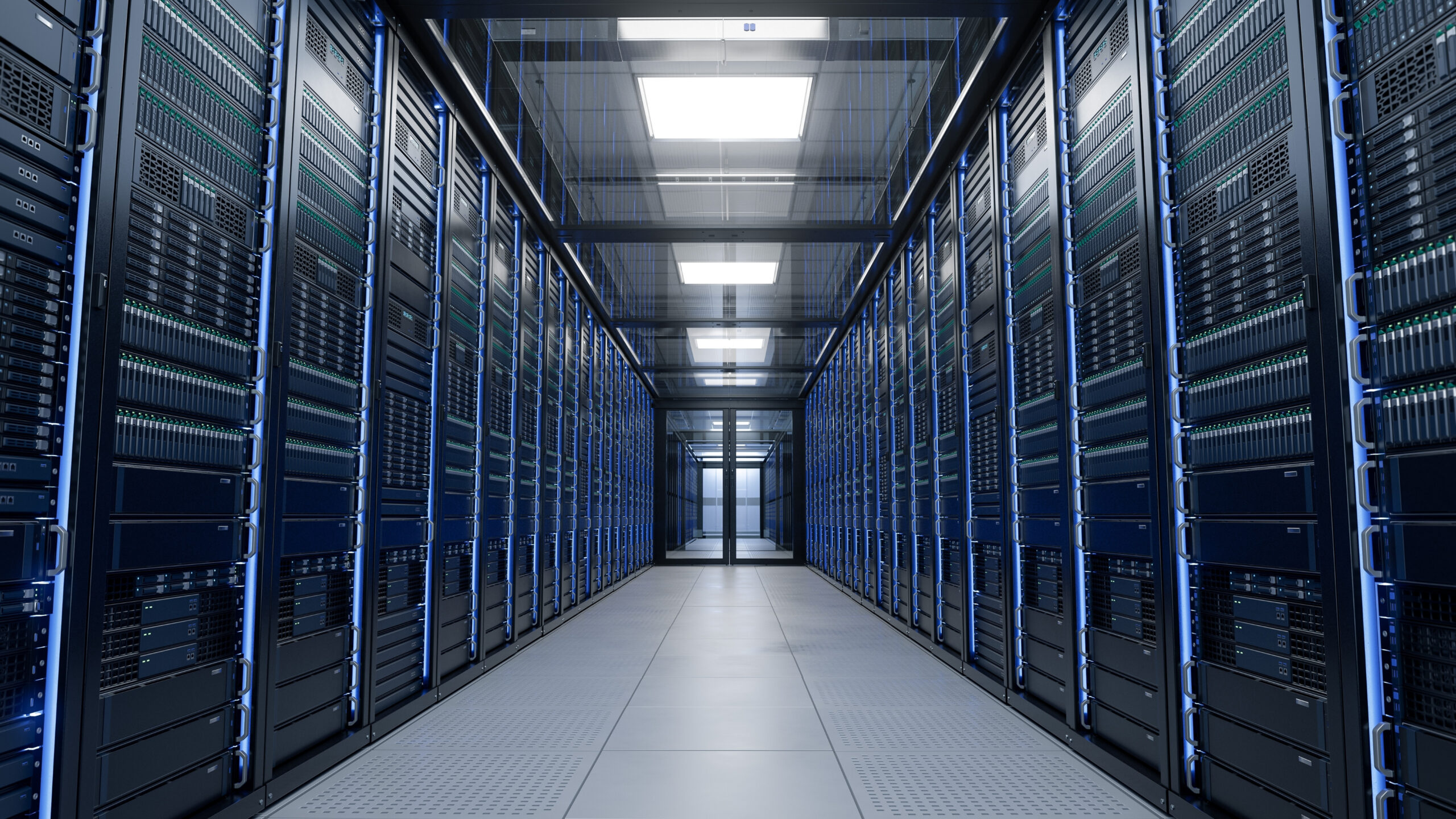 A brightly lit data center corridor lined with server racks on both sides, displaying rows of blinking indicator lights.